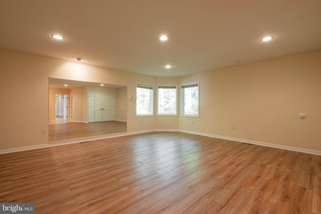 spare room with light hardwood / wood-style floors