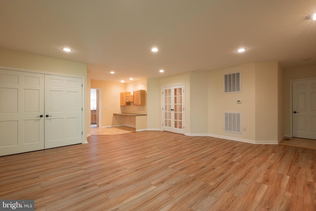 unfurnished living room featuring light hardwood / wood-style flooring