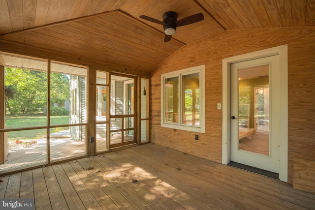 unfurnished sunroom featuring ceiling fan and wooden ceiling