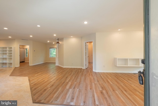 unfurnished living room featuring light hardwood / wood-style flooring