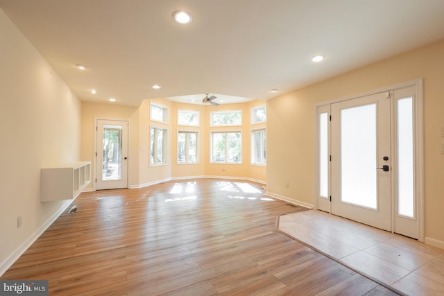 entrance foyer featuring light wood-type flooring and ceiling fan