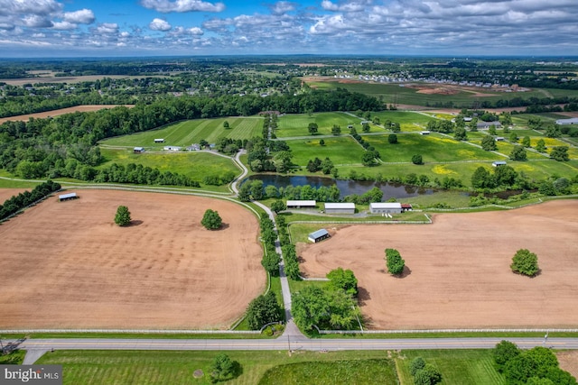 drone / aerial view featuring a rural view and a water view