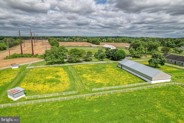 birds eye view of property with a rural view