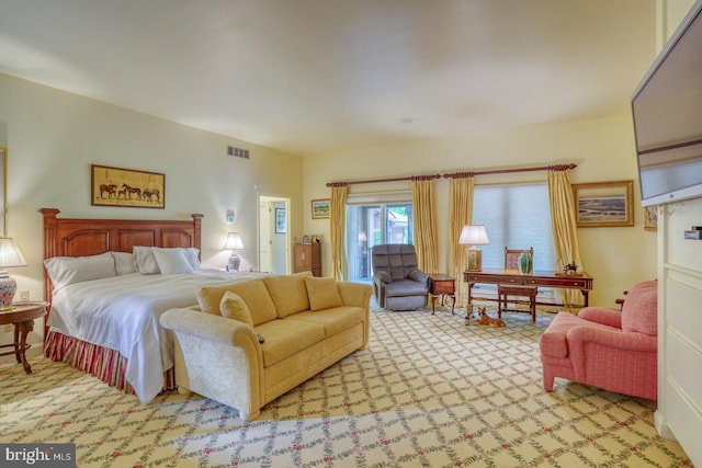 bedroom featuring light carpet