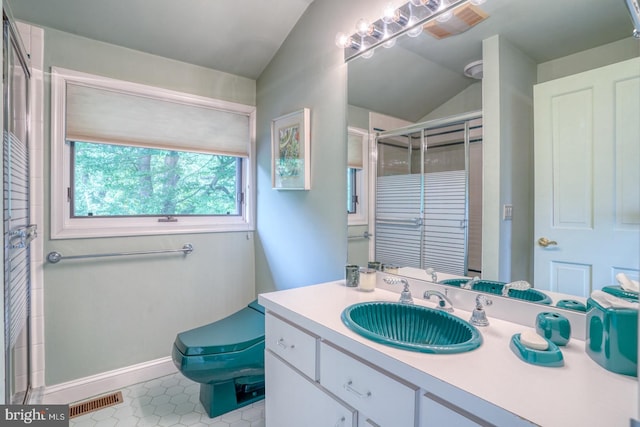 bathroom featuring vanity, lofted ceiling, an enclosed shower, tile patterned floors, and toilet