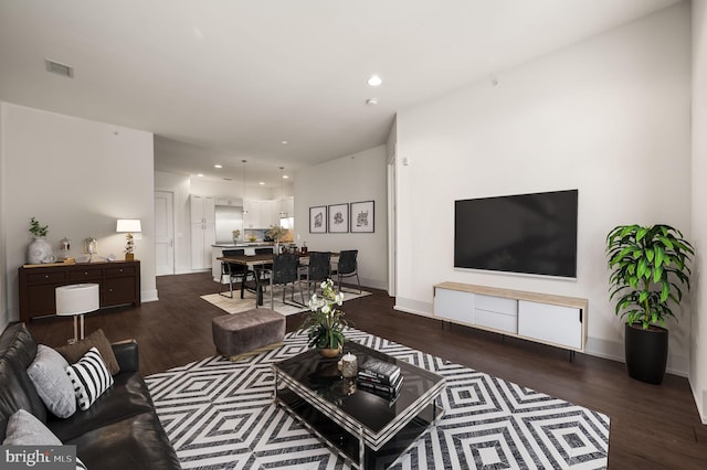 living room with dark hardwood / wood-style floors