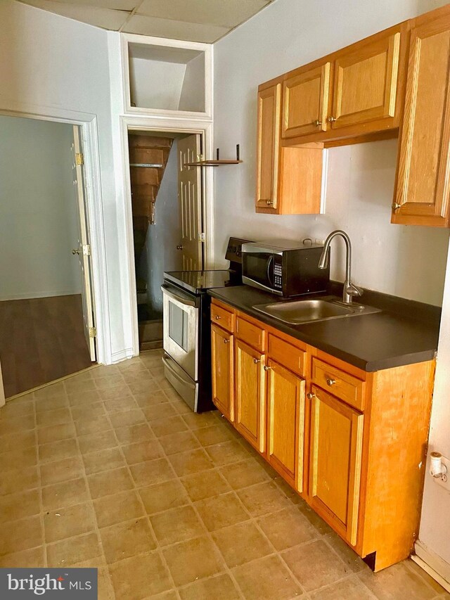 kitchen featuring sink and stainless steel electric range oven