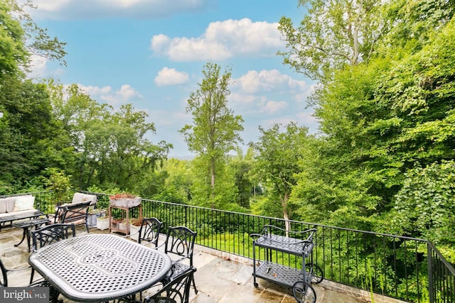 view of patio featuring a balcony