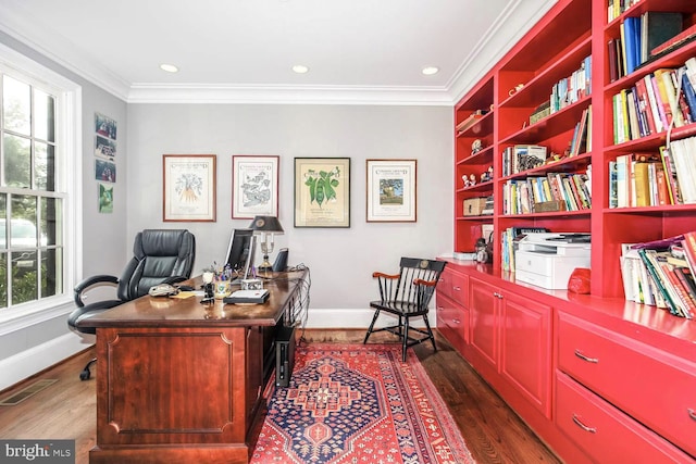 office space featuring ornamental molding and dark hardwood / wood-style flooring