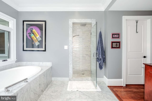 bathroom with wood-type flooring, independent shower and bath, and ornamental molding