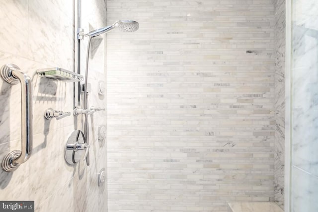 bathroom with a tile shower