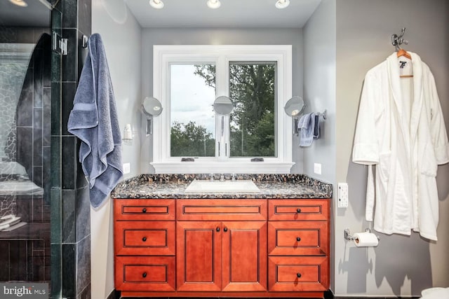 bathroom with vanity and an enclosed shower