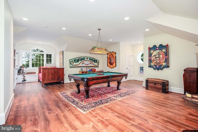 game room featuring hardwood / wood-style floors, vaulted ceiling, and pool table