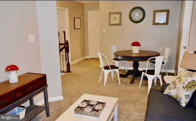 dining area with light carpet