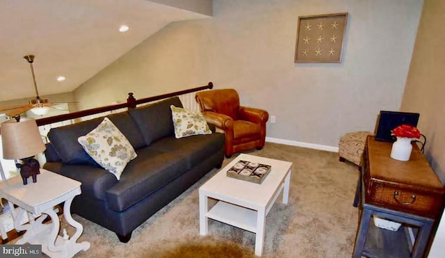 carpeted living room with vaulted ceiling and ceiling fan