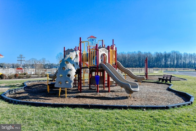 view of jungle gym featuring a lawn