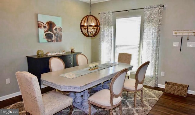 dining space with dark hardwood / wood-style flooring