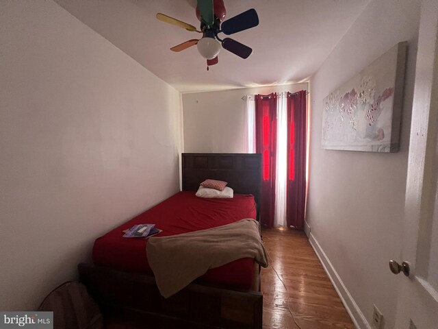 bedroom featuring ceiling fan and wood-type flooring