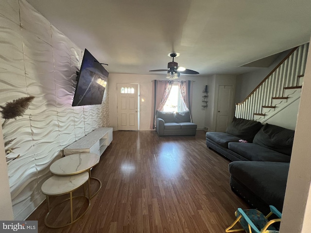 living room with ceiling fan and hardwood / wood-style flooring