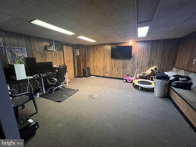 carpeted office space with wooden walls