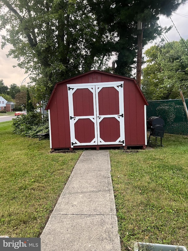 outdoor structure at dusk with a lawn