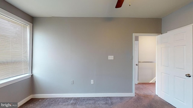 unfurnished bedroom with carpet and ceiling fan