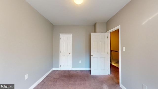 unfurnished bedroom with carpet floors