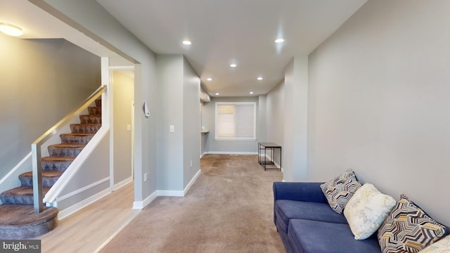 living room featuring light carpet