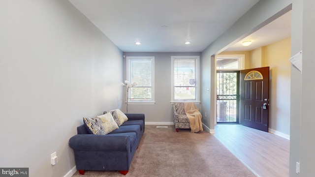 sitting room featuring light hardwood / wood-style floors