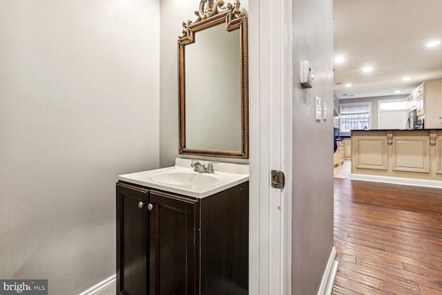 bathroom featuring vanity and hardwood / wood-style floors