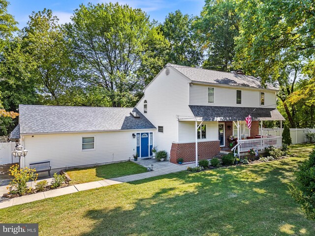 view of property featuring a front lawn