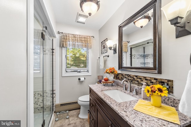 bathroom featuring tasteful backsplash, vanity, walk in shower, toilet, and a baseboard heating unit