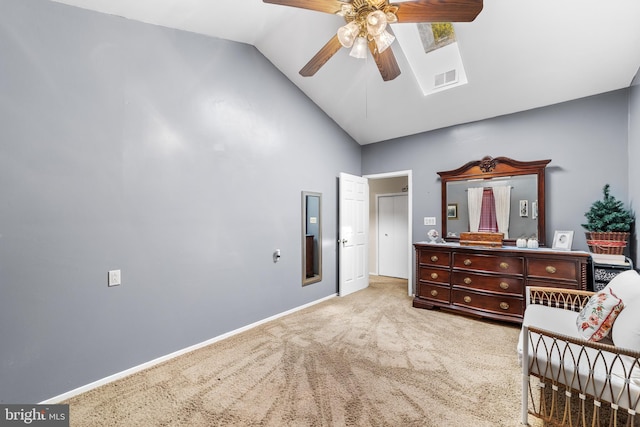 sitting room featuring vaulted ceiling, ceiling fan, and light colored carpet