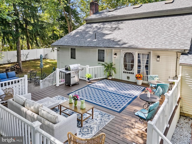 deck featuring an outdoor hangout area and grilling area