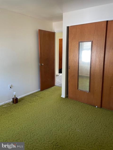 unfurnished room featuring carpet flooring