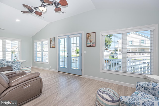 living room with french doors, ceiling fan, light hardwood / wood-style floors, and a healthy amount of sunlight