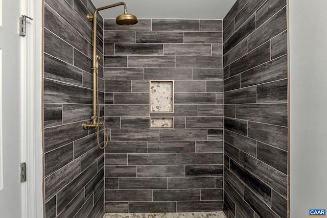 bathroom with tiled shower