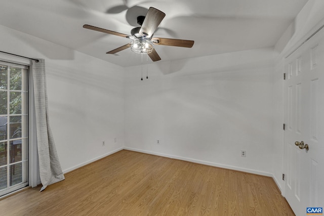 spare room with ceiling fan and light hardwood / wood-style flooring