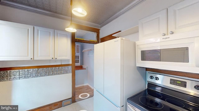 kitchen with ornamental molding, white cabinets, hardwood / wood-style flooring, and white appliances