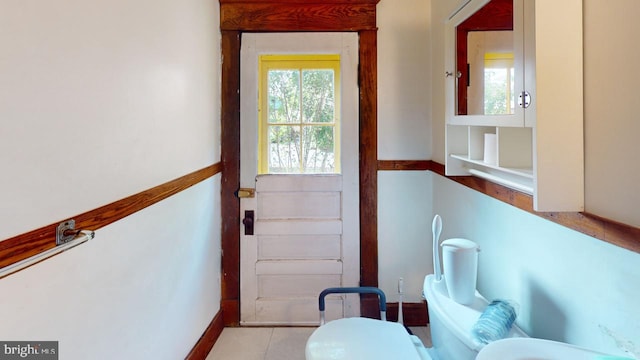 doorway to outside with baseboards