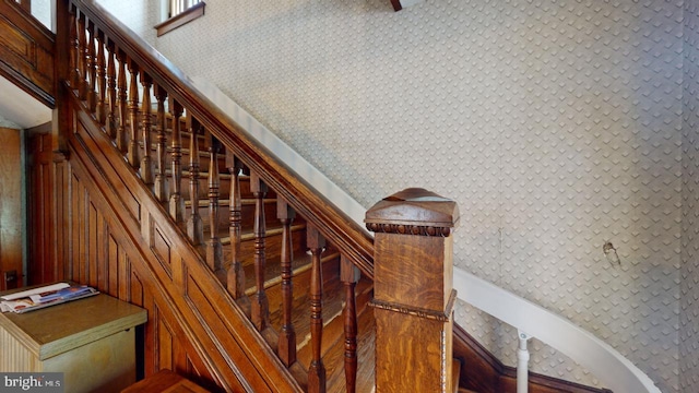 stairs with wood walls