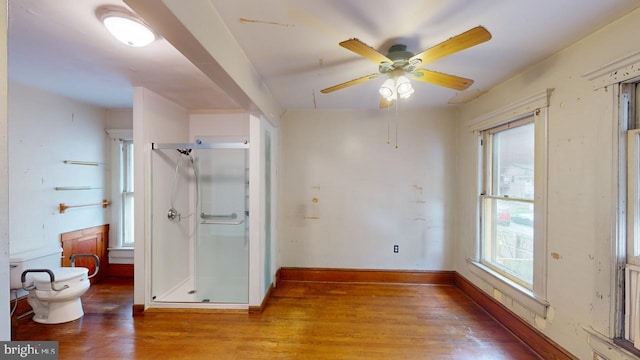 interior space with light wood-type flooring and ceiling fan