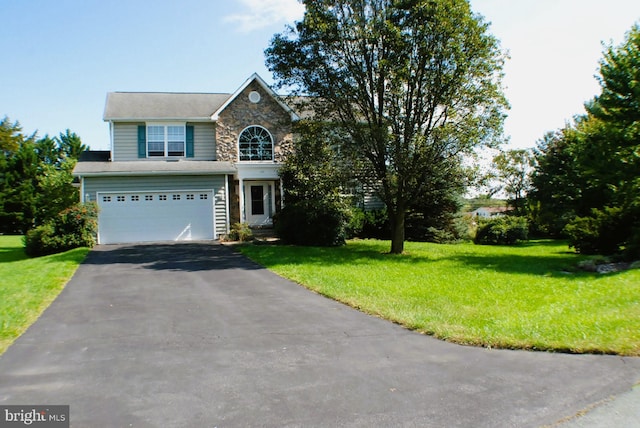 front of property featuring a garage and a front lawn