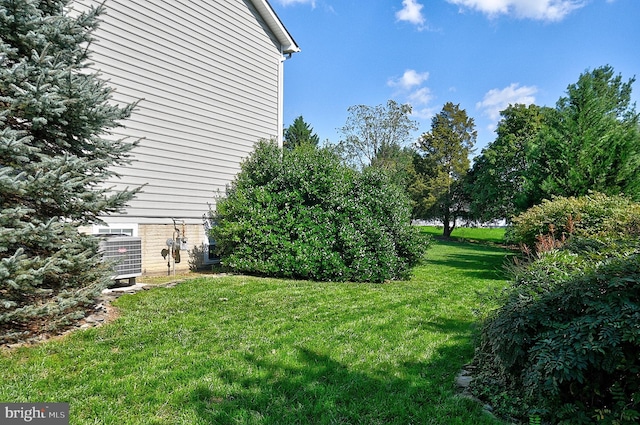 view of yard with central AC