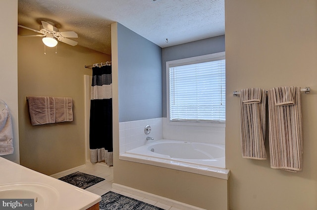 bathroom featuring vanity, a textured ceiling, separate shower and tub, and tile patterned floors