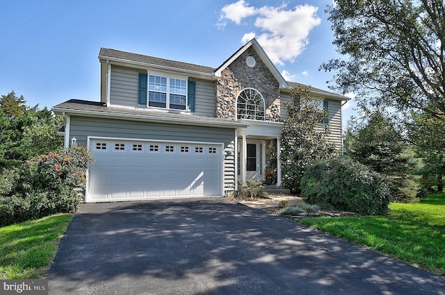 view of front of property with a garage