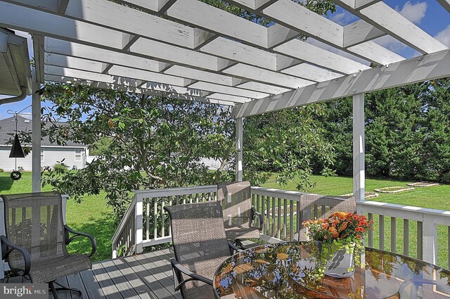 wooden terrace with a pergola and a yard