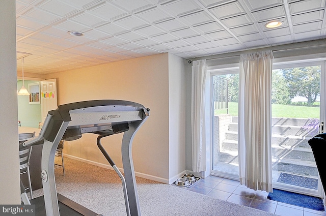 workout area featuring tile patterned floors