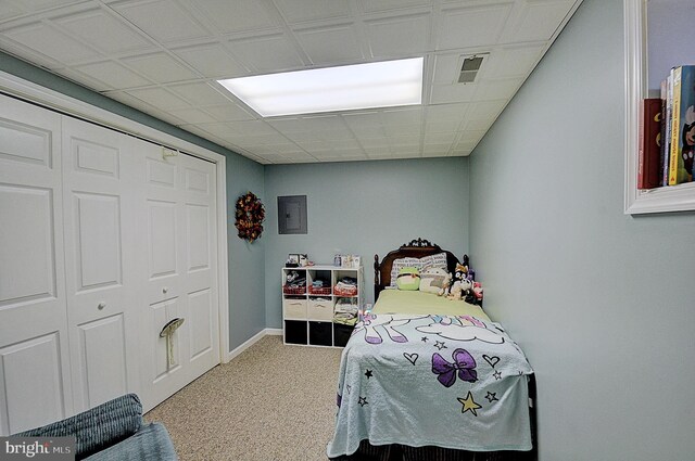 bedroom featuring a closet and carpet flooring