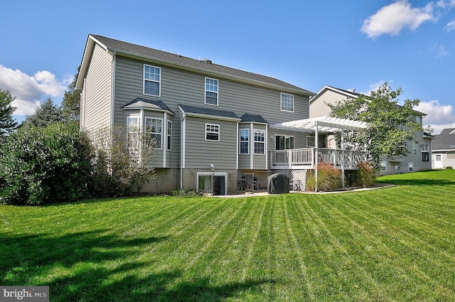 back of property featuring a lawn, a pergola, and a deck